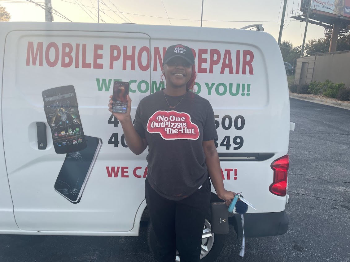 Satisfied customer with repaired phone - Phone repair service Decatur GA